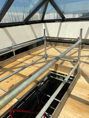 Construction of a wooden work platform for skylight repairs